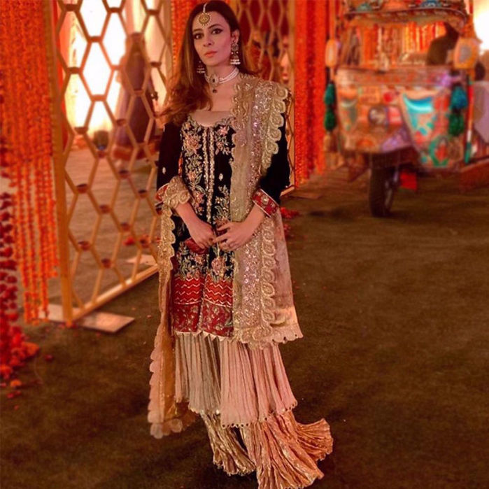 Picture of A perfect mix of contemporary and modern. “Depalpur” a beautifully embellished shirt, on a canvas of pure velvet that is meticulously detailed to perfection blending rich colours